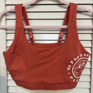 Reddish orange gymshark legacy sports bra
